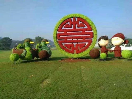 仿真绿雕也可以做沙发的样子哦 鸳鸯婚庆仿真绿雕批发价